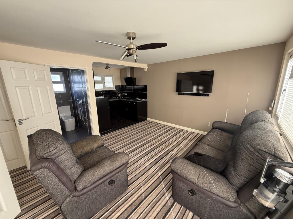 Lot: 68 - TWO-BEDROOM CHALET - Open plan living room and kitchen